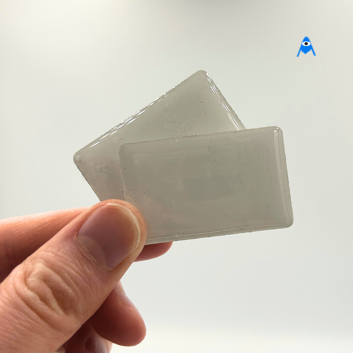 Two metal rectangular adhesive tags
